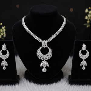 Silver-tone floral pendant necklace set with matching earrings